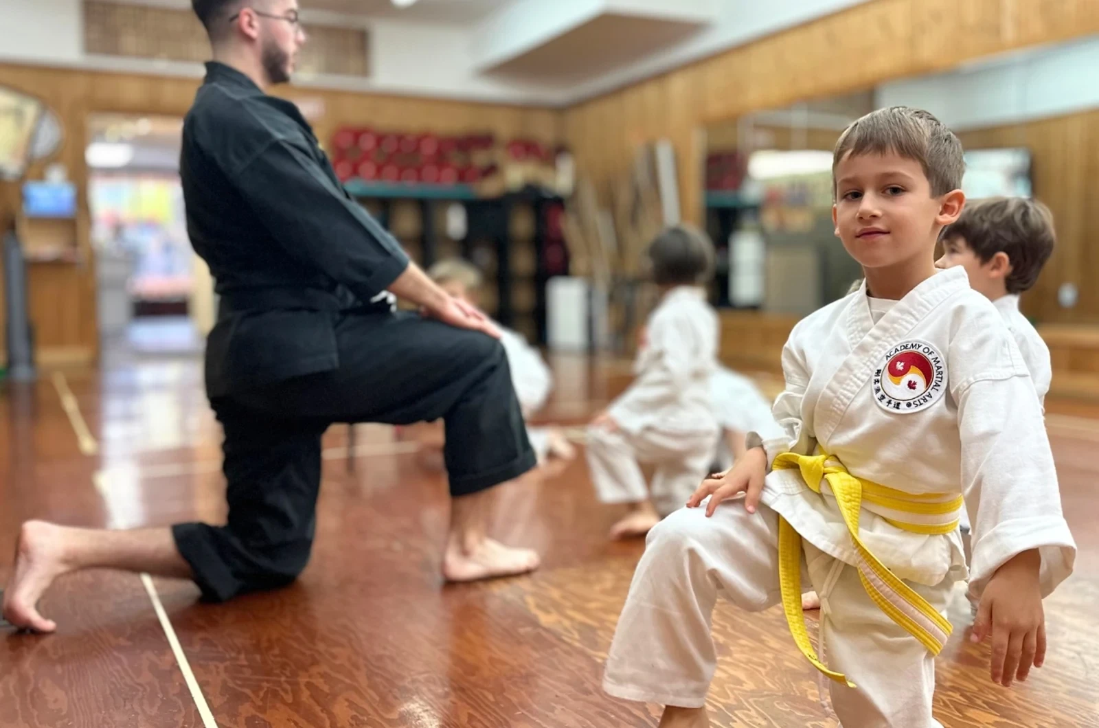 Kids learning sportsmanship through martial arts